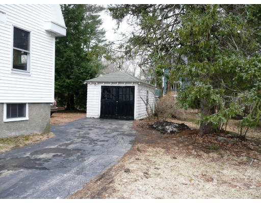 14 Harding Road Lexington, MA 02420 - Photo 6 of 9 a front view of a house with a yard and garage