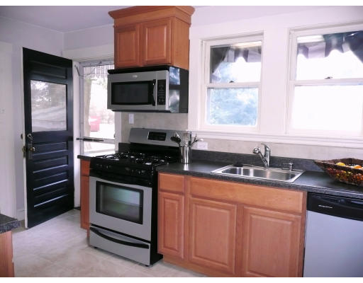 14 Harding Road Lexington, MA 02420 - Photo 8 of 9 a kitchen with stainless steel appliances a stove a sink and a microwave