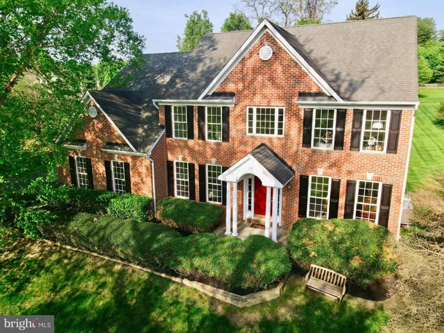 an aerial view of residential houses and trees