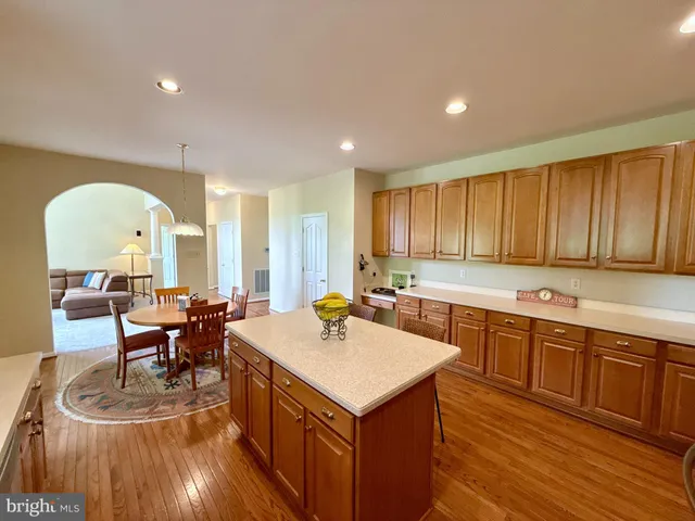 a view of a house with a patio and a yard