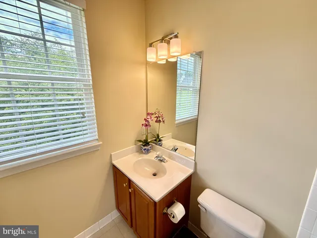 a bed room with a bed and a window