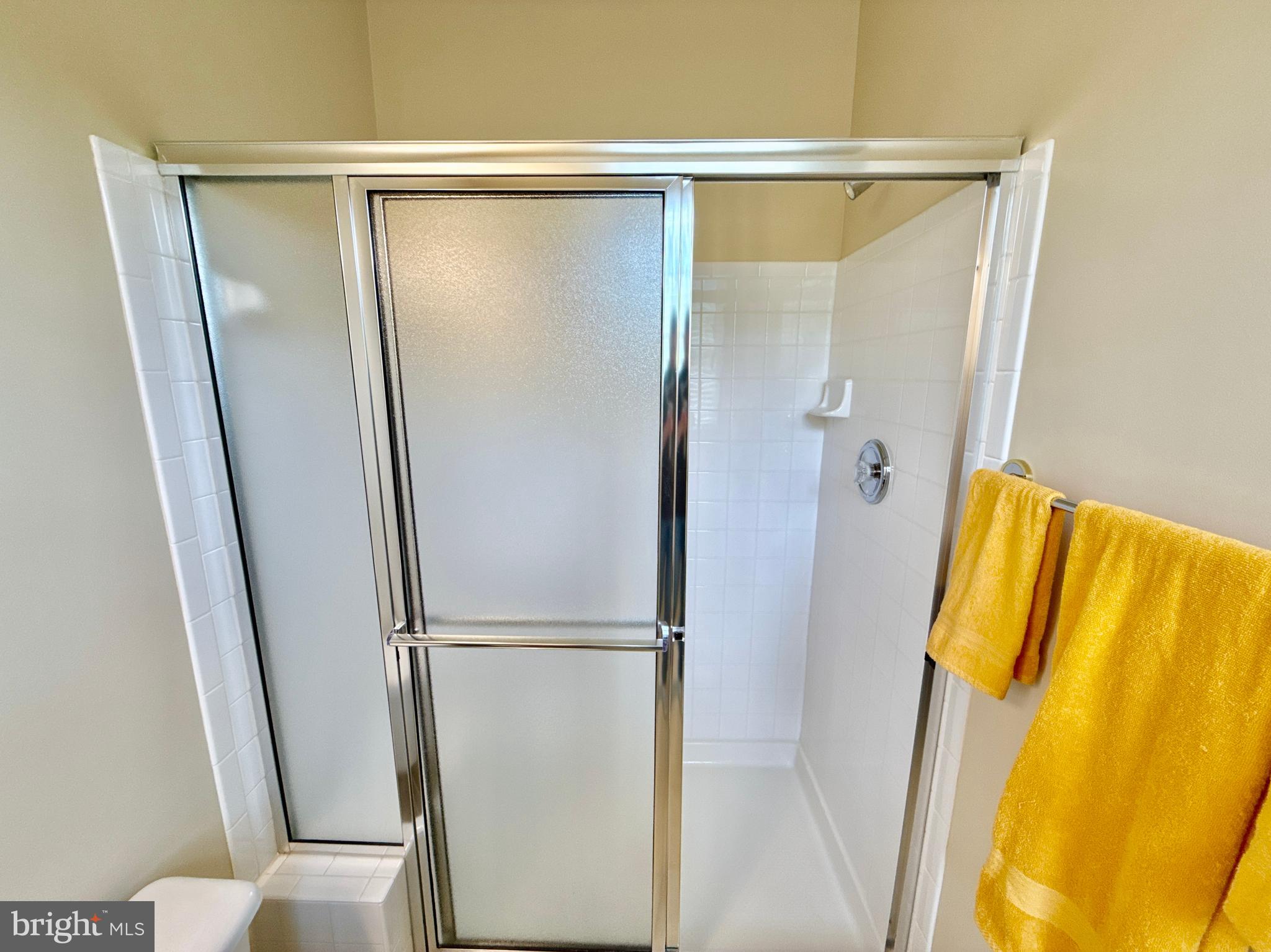 14100 Twisting Lane Dayton, MD 21036 - Photo 33 of 63 a bathroom with a shower and a tub