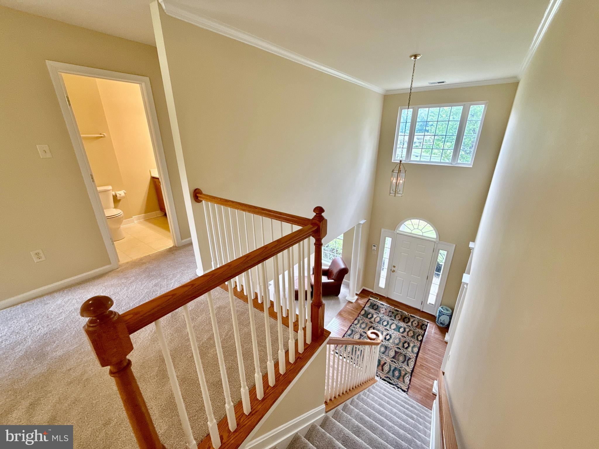 14100 Twisting Lane Dayton, MD 21036 - Photo 34 of 63 a view of a livingroom with wooden floor and stairs