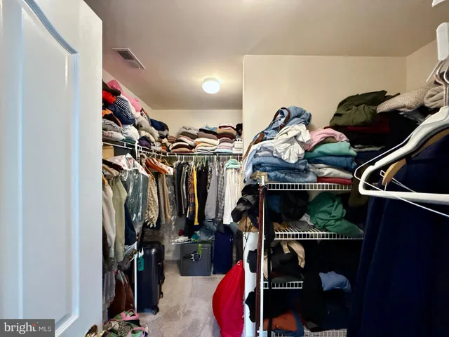a bathroom with a double vanity sink mirror and toilet