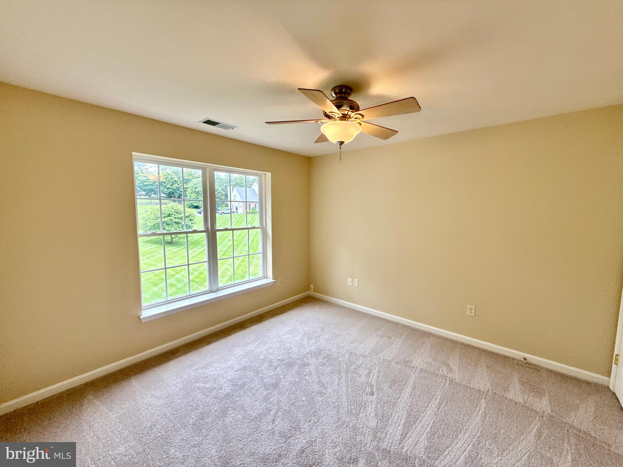14100 Twisting Lane Dayton, MD 21036 - Photo 49 of 63 a view of an empty room with a window