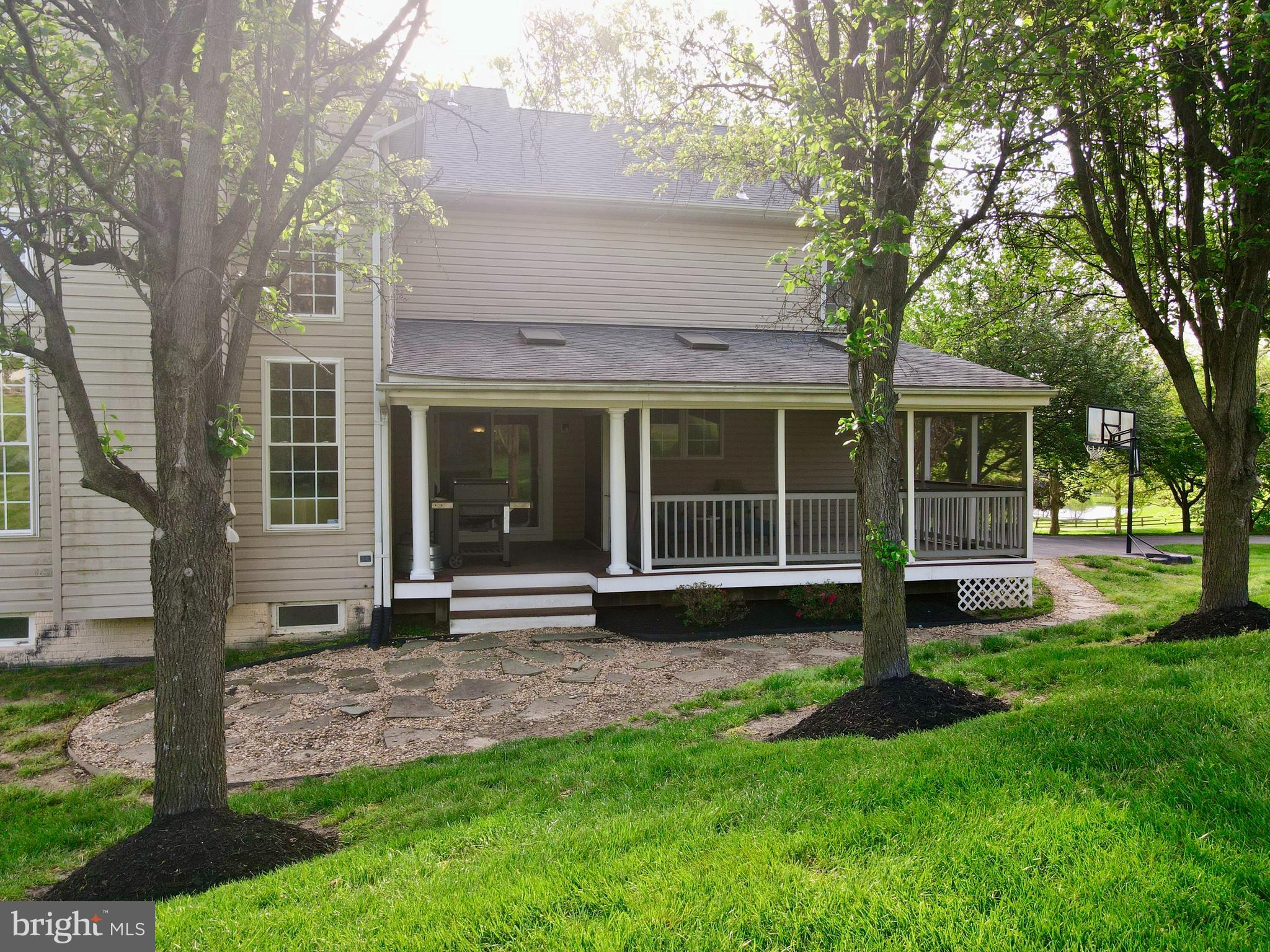 14100 Twisting Lane Dayton, MD 21036 - Photo 5 of 63 a view of house with a yard and large tree