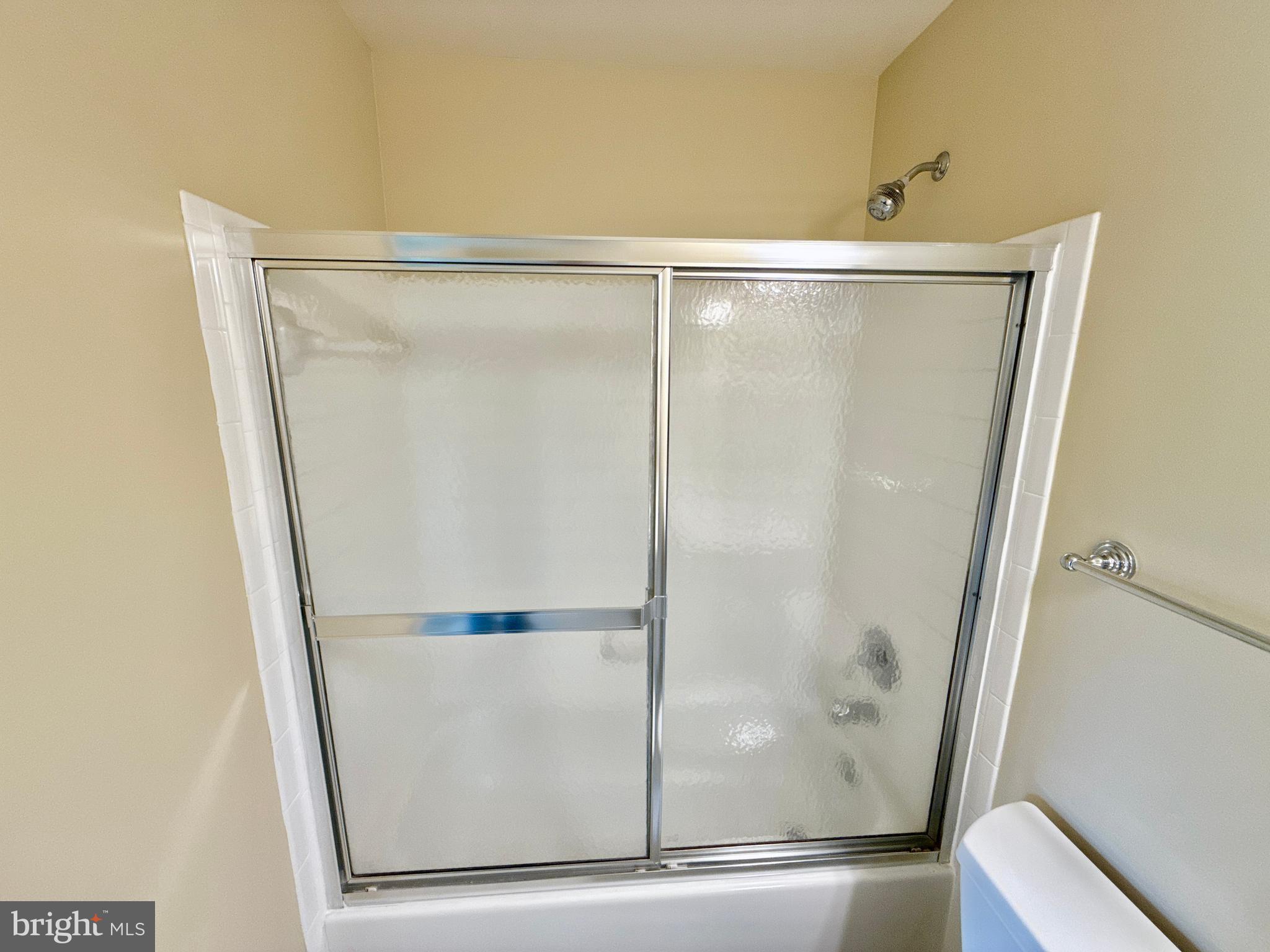 14100 Twisting Lane Dayton, MD 21036 - Photo 54 of 63 a bathroom with a glass shower door