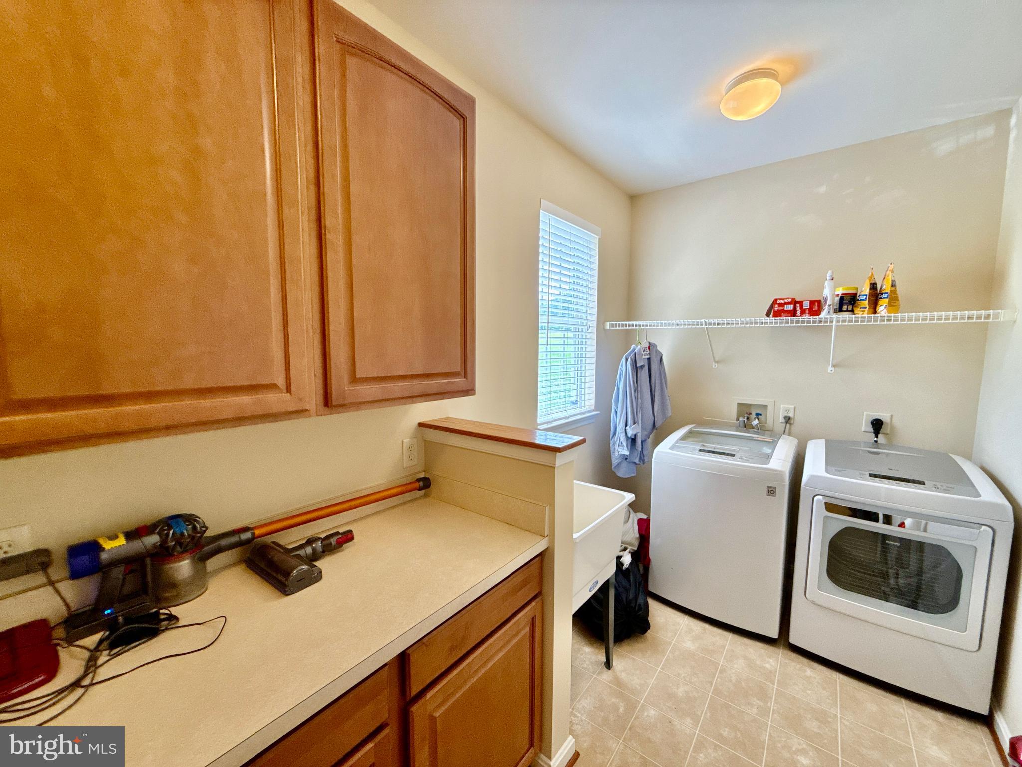 14100 Twisting Lane Dayton, MD 21036 - Photo 55 of 63 a utility room with dryer and washer