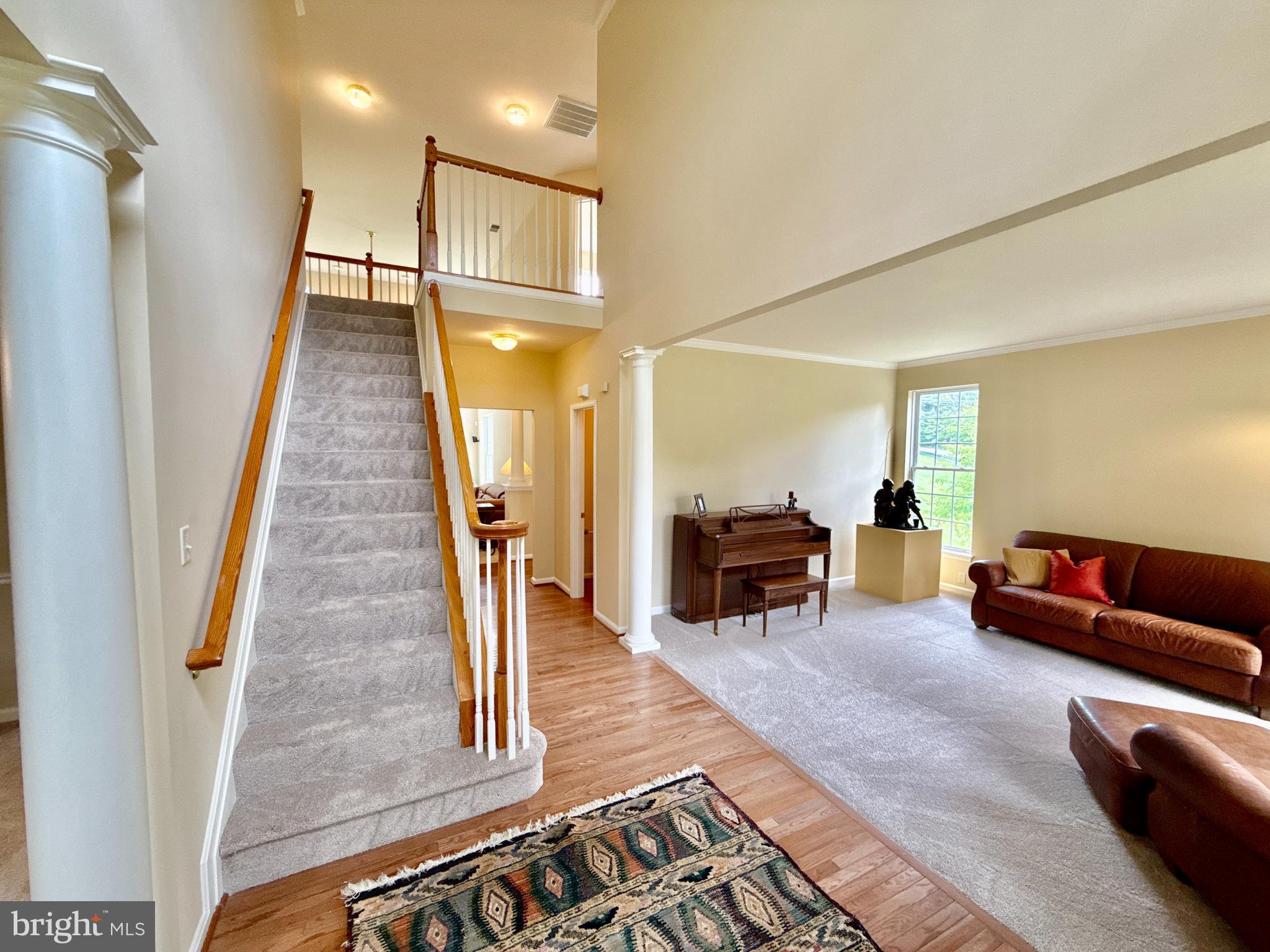 14100 Twisting Lane Dayton, MD 21036 - Photo 8 of 63 a living room with furniture and a fireplace
