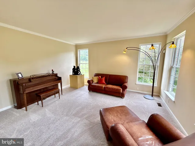 a view of a dining room with furniture and window