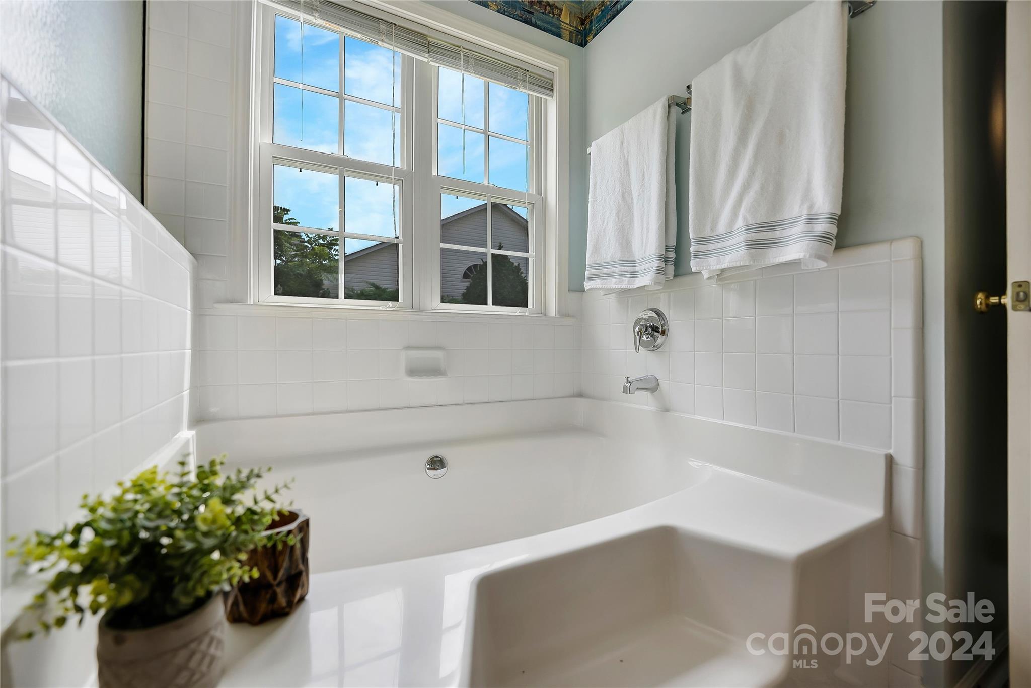 115 English Oak Road Fletcher, NC 28732 - Photo 17 of 30 a bath tub sitting next to a window