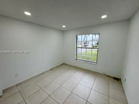 a view of a kitchen with a sink and a window