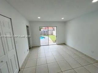 a view of an empty room and window