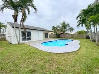 26508 Southwest 128th Court Homestead, FL 33032 - Photo 3 of 19 a view of a backyard with potted plants