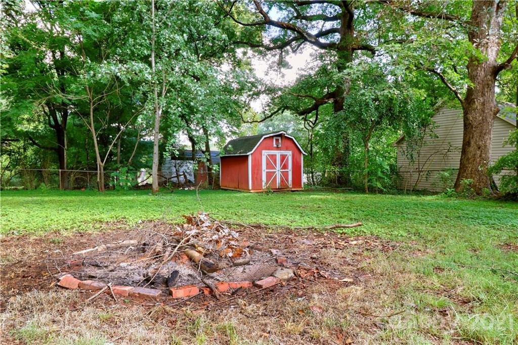 105 Stony Point School Road Stony Point, NC 28678 - Photo 22 of 25 a view of backyard with garden and trees