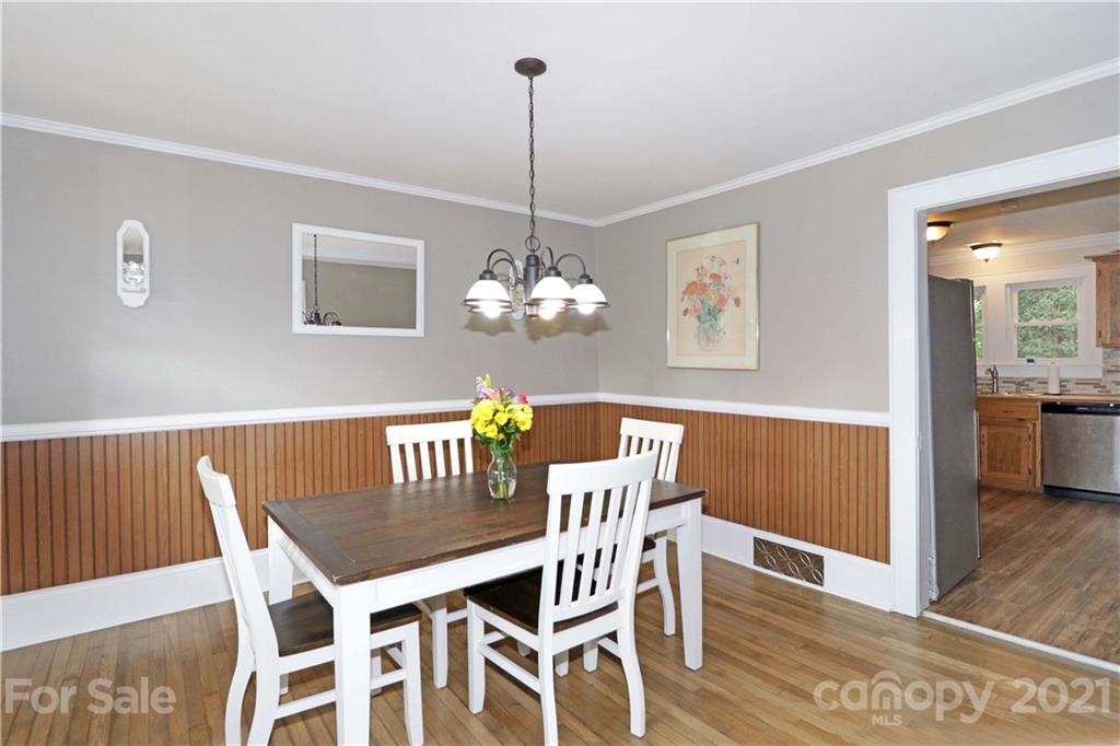 105 Stony Point School Road Stony Point, NC 28678 - Photo 6 of 25 a view of a dining room with furniture wooden floor and a chandelier