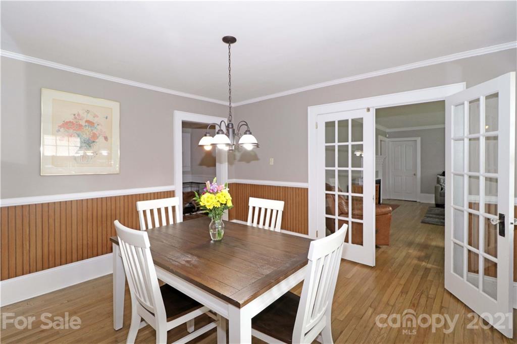 105 Stony Point School Road Stony Point, NC 28678 - Photo 7 of 25 a view of a dining room with furniture wooden floor and chandelier