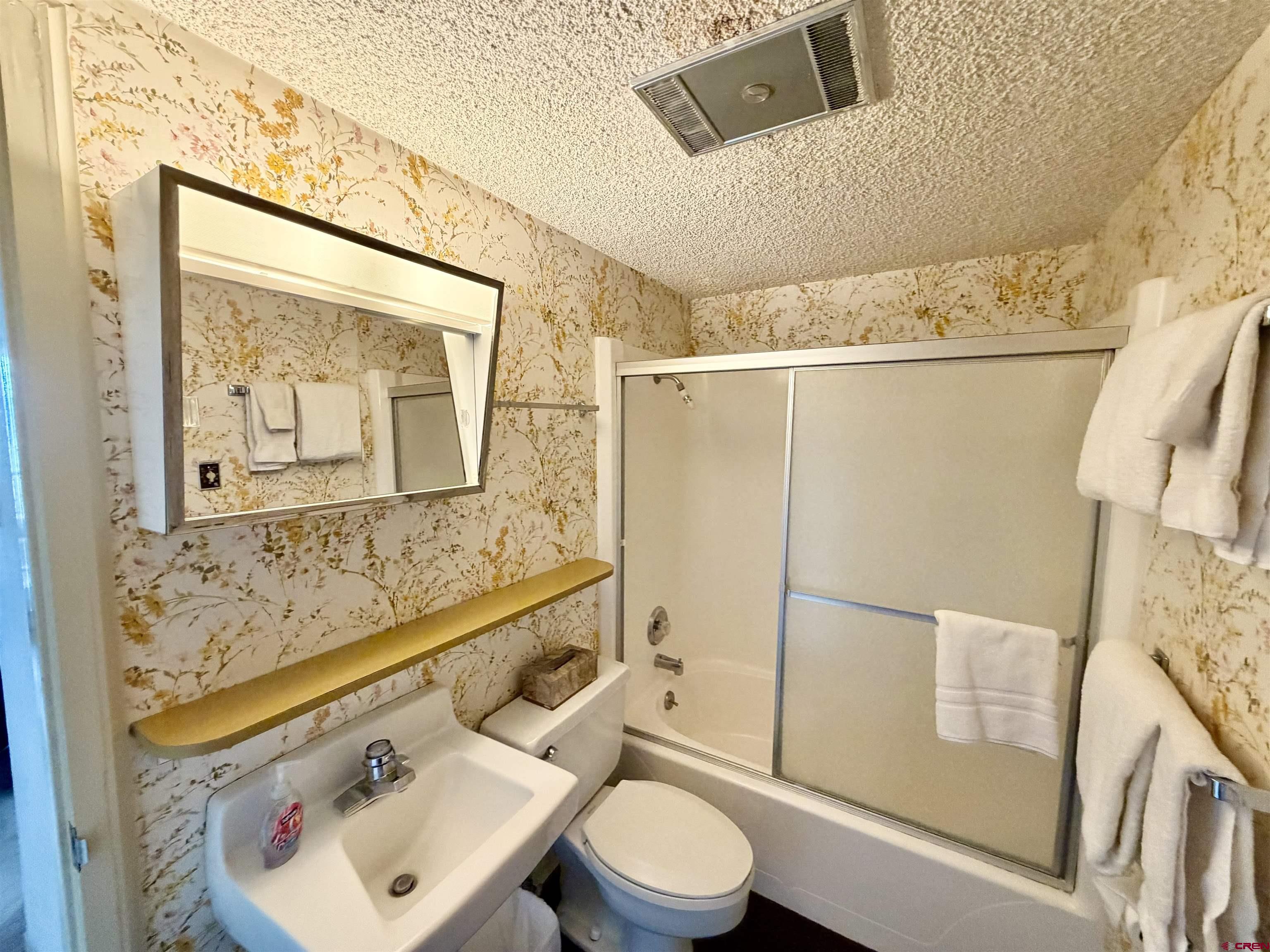 51 Whetstone Road, Unit 2306 Crested Butte, CO 81225 - Photo 29 of 44 a bathroom with a sink toilet and shower
