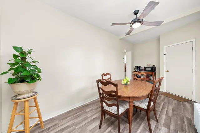 a dining room with furniture and window