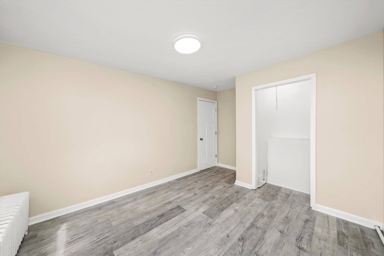 4218 Home Avenue Stickney, IL 60402 - Photo 15 of 35 an empty room with wooden floor and windows