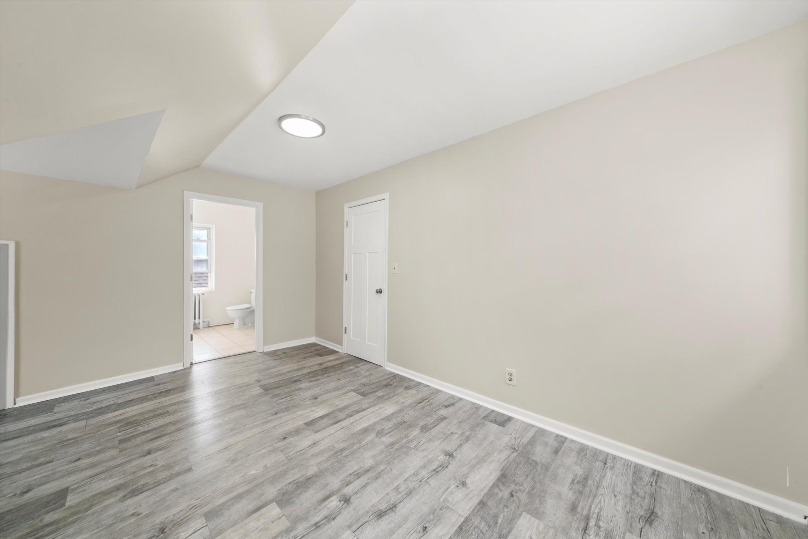 4218 Home Avenue Stickney, IL 60402 - Photo 18 of 35 a view of an empty room with wooden floor and a window