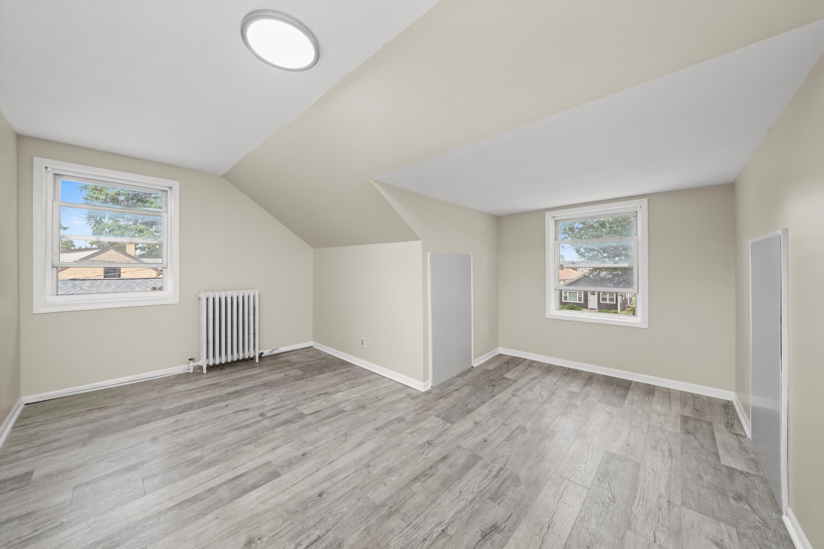 4218 Home Avenue Stickney, IL 60402 - Photo 19 of 35 an empty room with wooden floor and windows