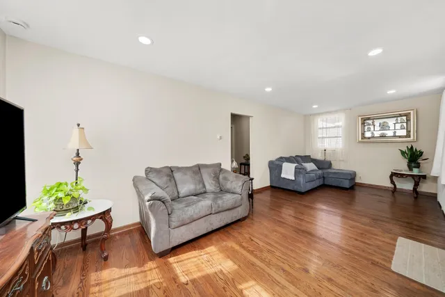 a living room with furniture and a table