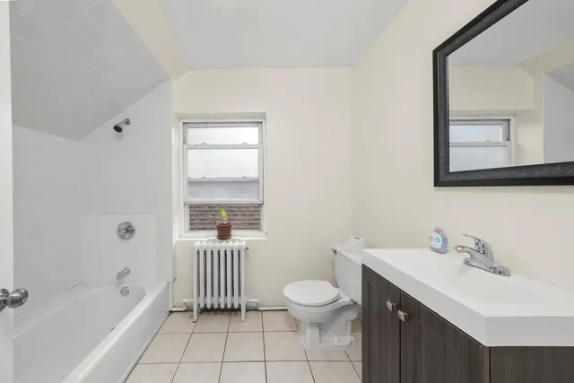 a bathroom with a sink a toilet and bathtub