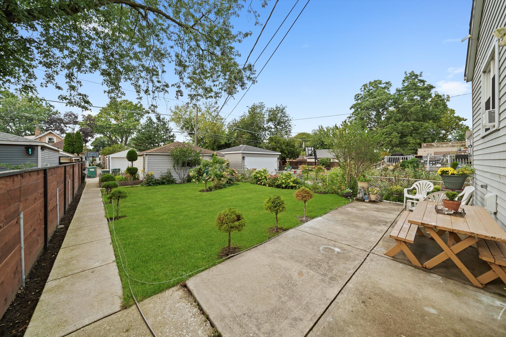 4218 Home Avenue Stickney, IL 60402 - Photo 25 of 35 a view of a street with potted plants and large trees