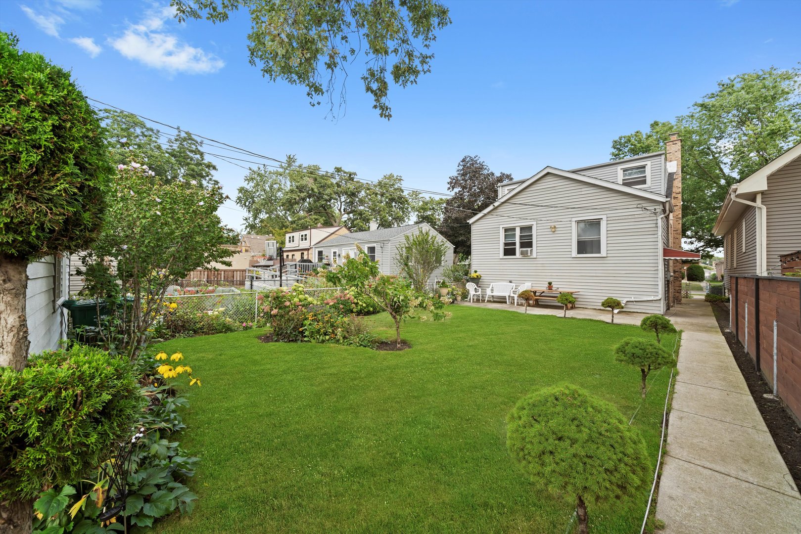 4218 Home Avenue Stickney, IL 60402 - Photo 27 of 35 a front view of a house with garden