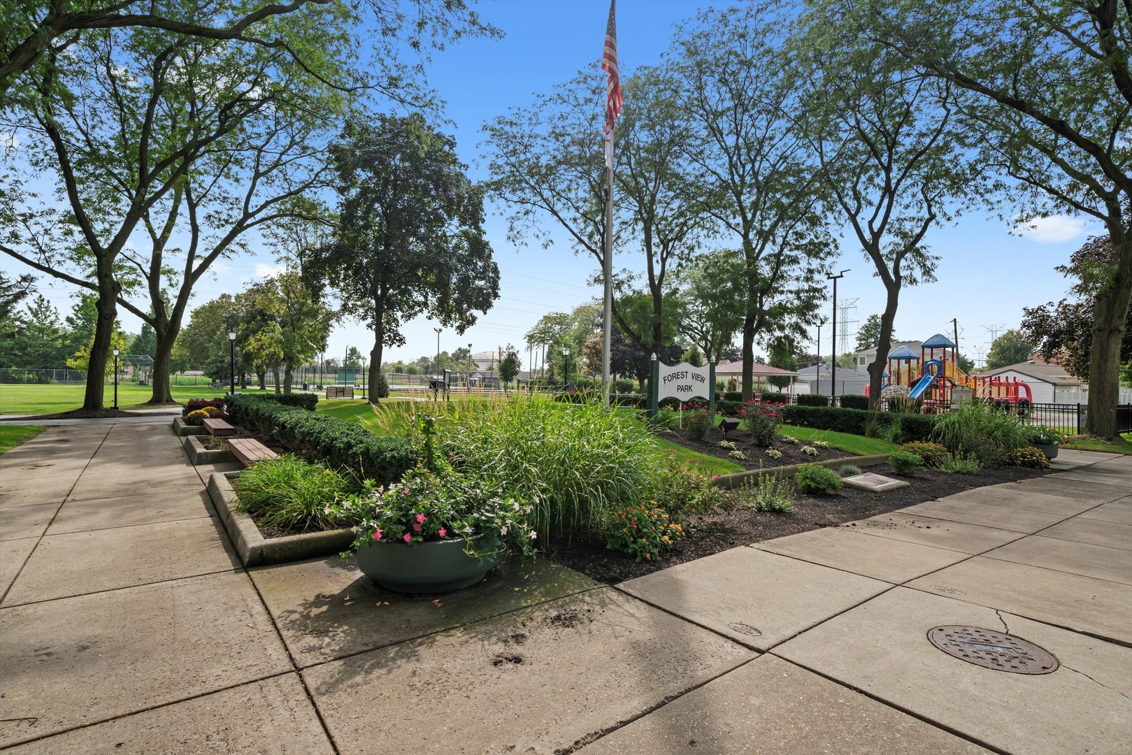 4218 Home Avenue Stickney, IL 60402 - Photo 34 of 35 a view of a garden with potted plants and large trees