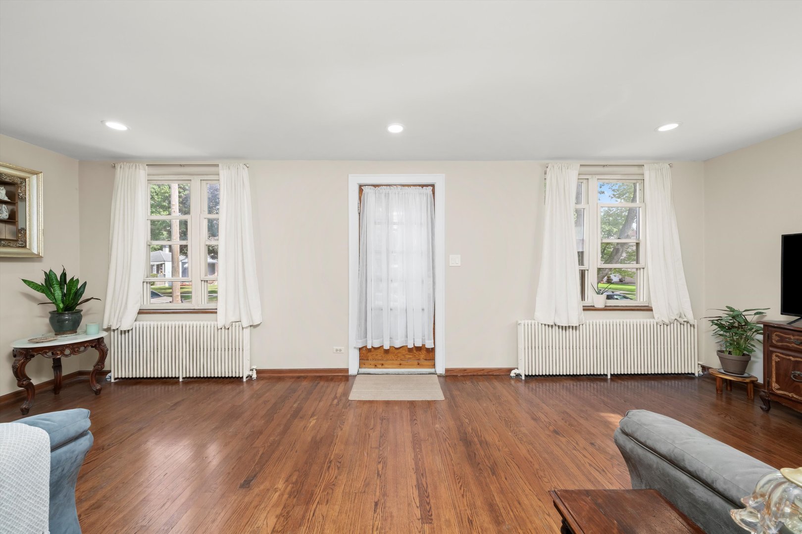 4218 Home Avenue Stickney, IL 60402 - Photo 5 of 35 a view of livingroom with hardwood floor and window