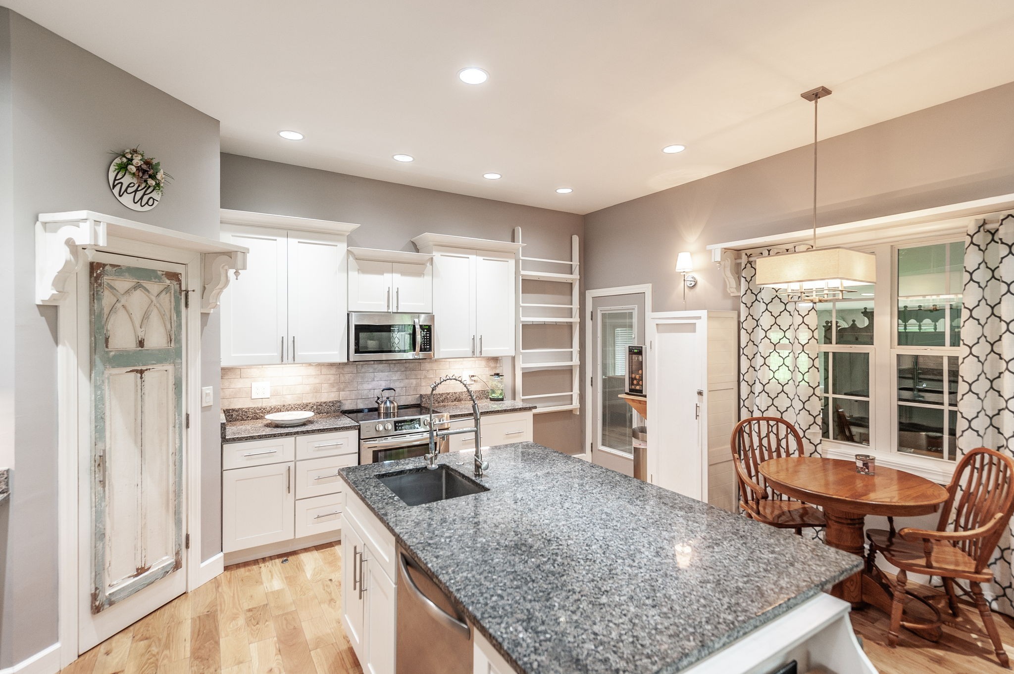 8338 Guthrie Road Cross Plains, TN 37049 - Photo 12 of 43 a kitchen with stainless steel appliances granite countertop a stove top oven a sink and a refrigerator
