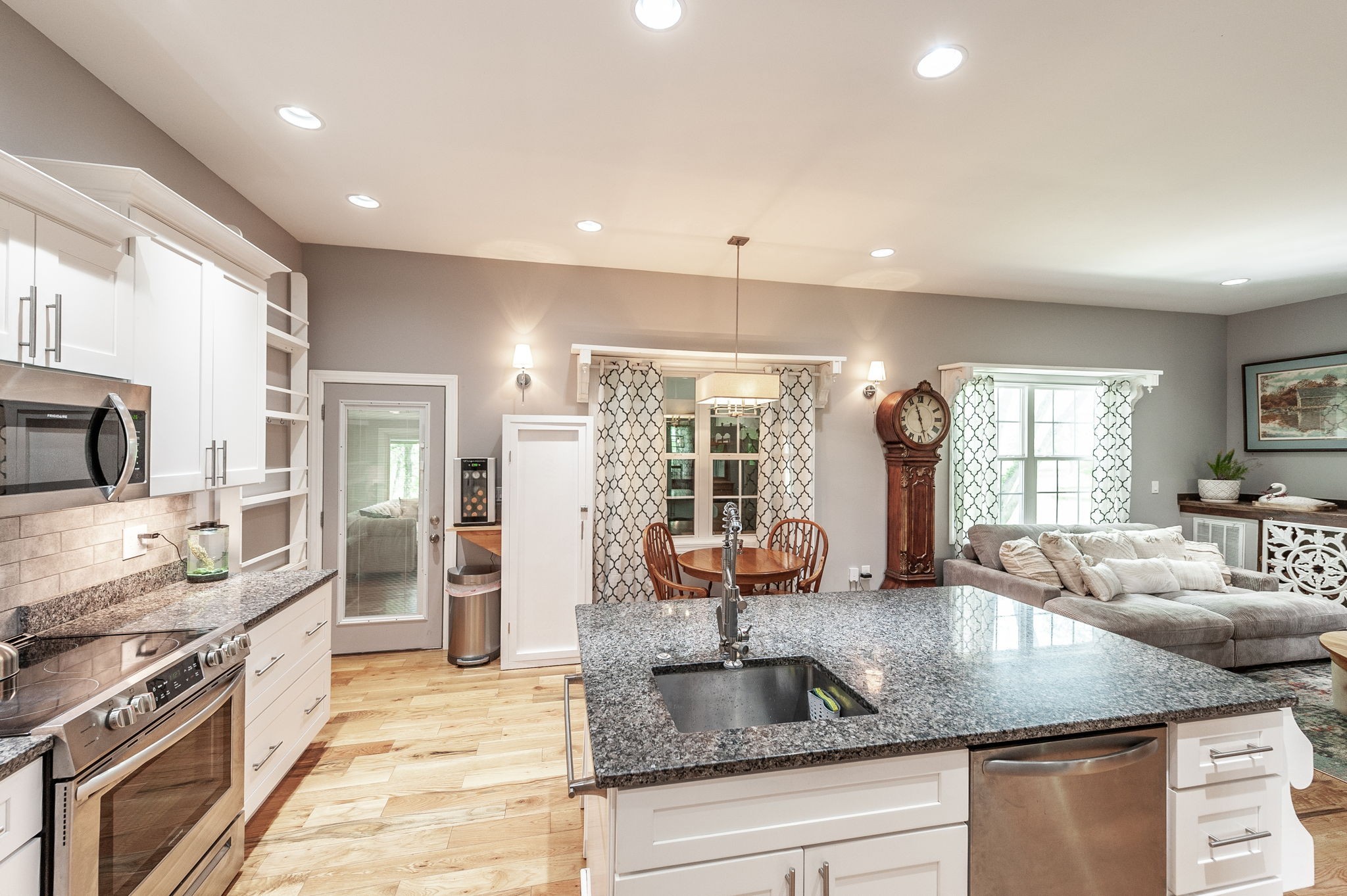8338 Guthrie Road Cross Plains, TN 37049 - Photo 13 of 43 a kitchen with granite countertop a sink and a counter top space