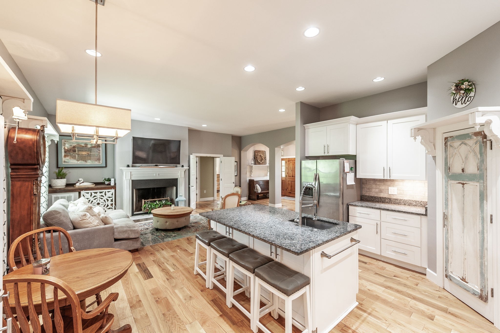 8338 Guthrie Road Cross Plains, TN 37049 - Photo 14 of 43 a kitchen with kitchen island granite countertop a stove and a view of living room