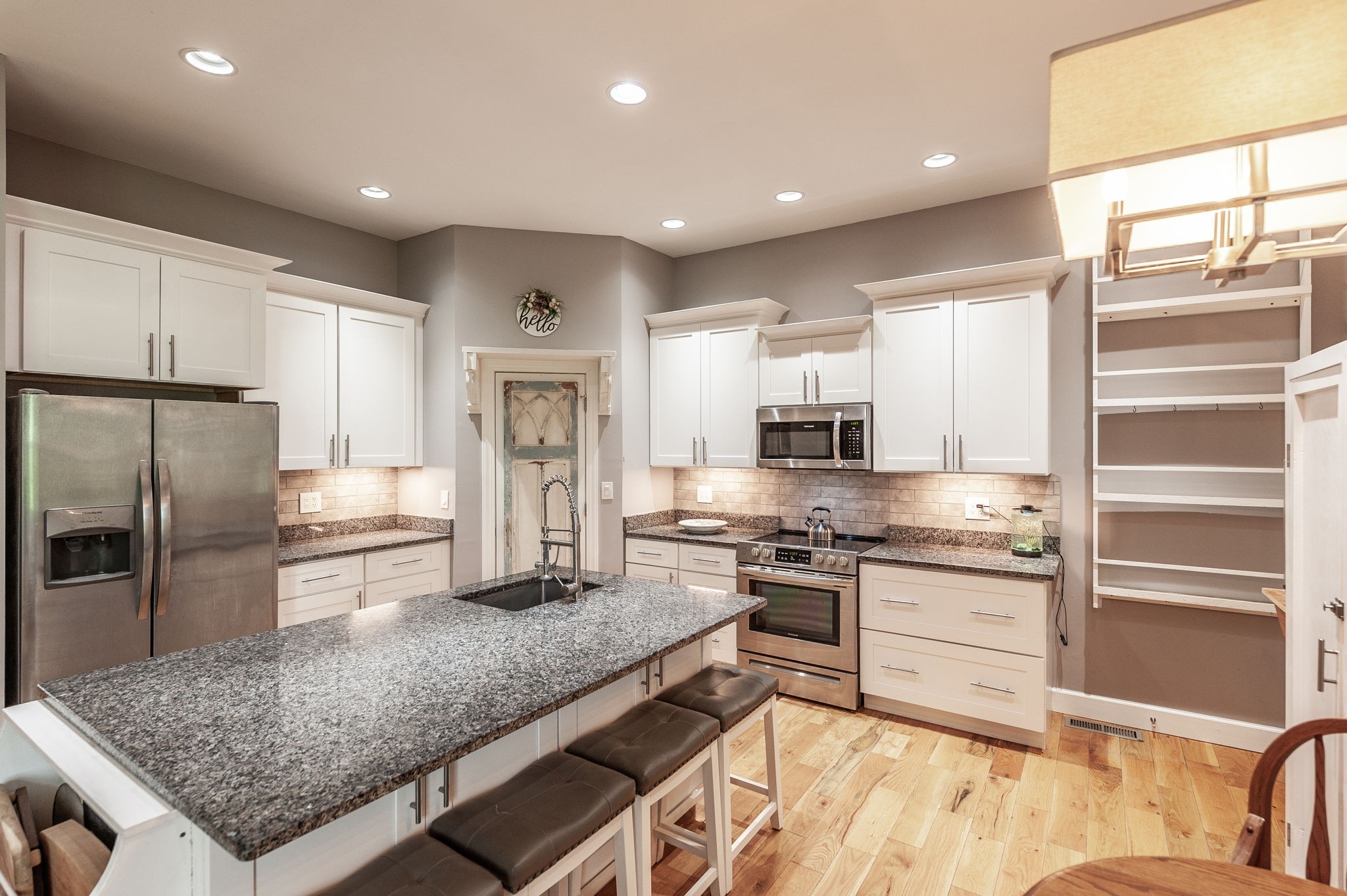 8338 Guthrie Road Cross Plains, TN 37049 - Photo 15 of 43 a kitchen with stainless steel appliances granite countertop a sink stove and refrigerator