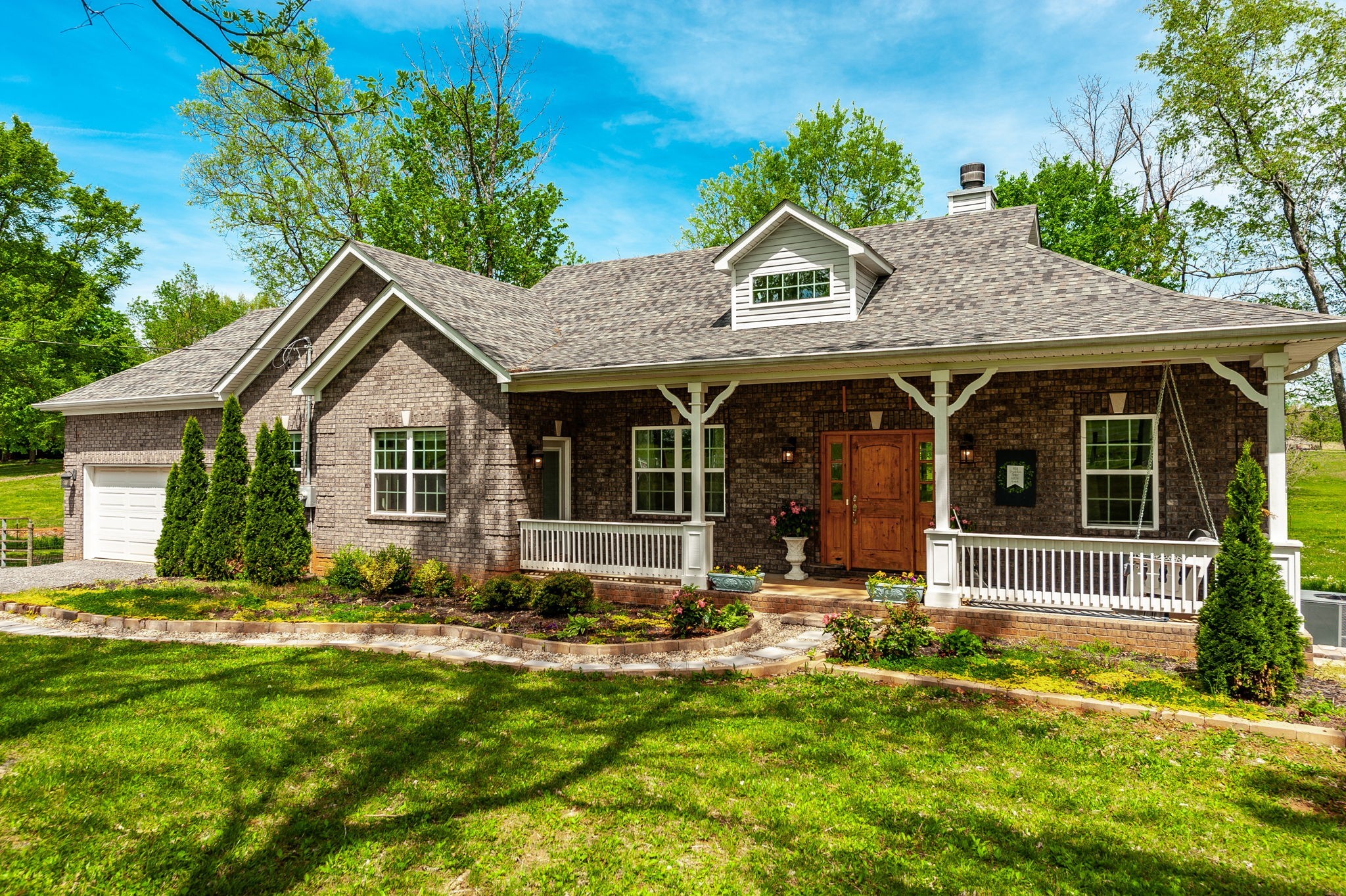 8338 Guthrie Road Cross Plains, TN 37049 - Photo 2 of 43 a front view of house with yard outdoor seating and garage