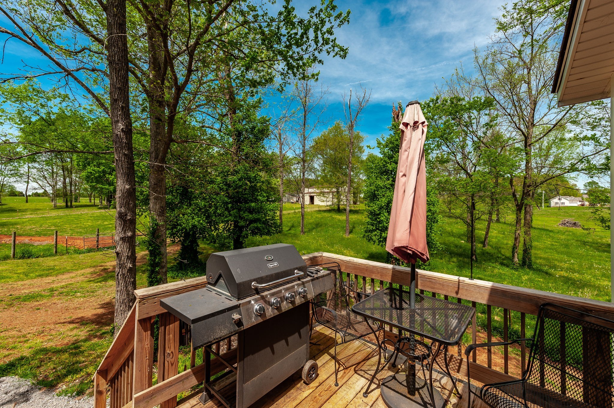 8338 Guthrie Road Cross Plains, TN 37049 - Photo 36 of 43 a view of a patio with a table chairs and a yard