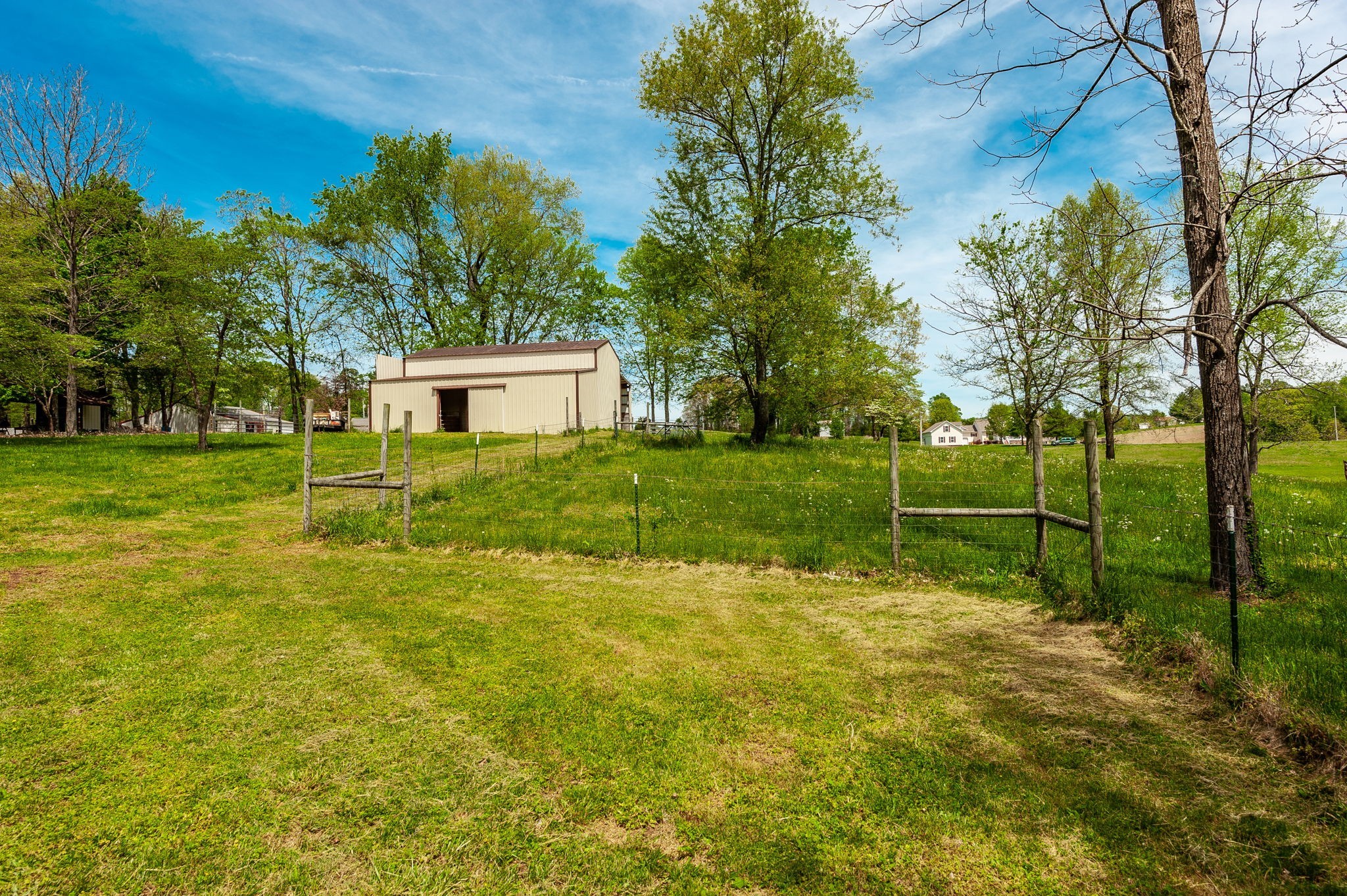 8338 Guthrie Road Cross Plains, TN 37049 - Photo 37 of 43 a backyard of a house with lots of green space and fountain
