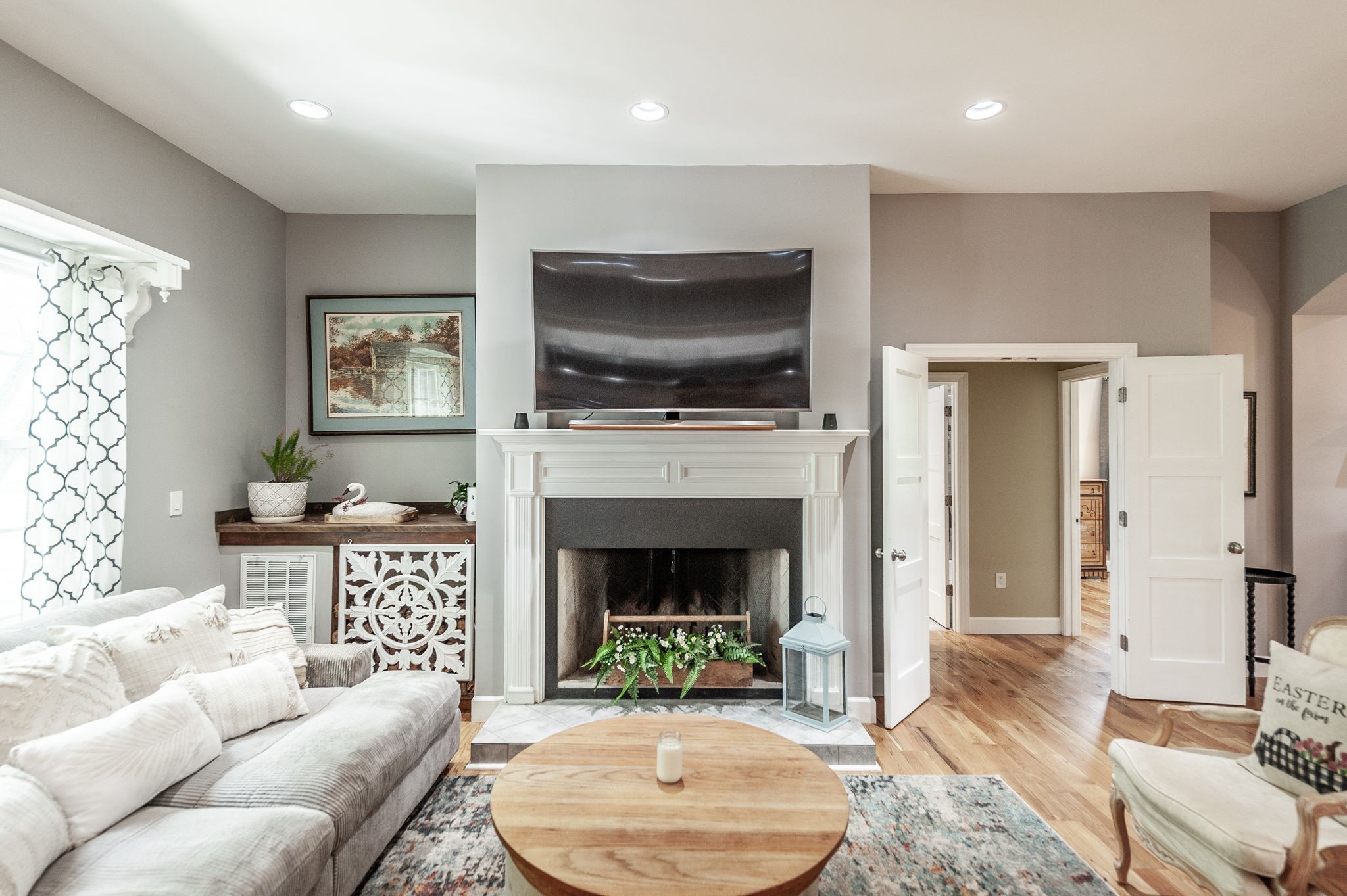 8338 Guthrie Road Cross Plains, TN 37049 - Photo 9 of 43 a living room with furniture a flat screen tv and a fireplace