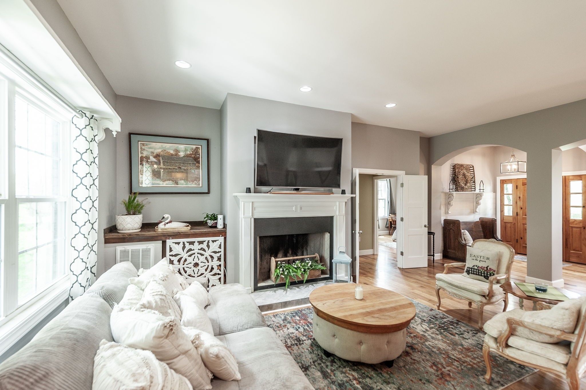 8338 Guthrie Road Cross Plains, TN 37049 - Photo 10 of 43 a living room with furniture a flat screen tv and a fireplace