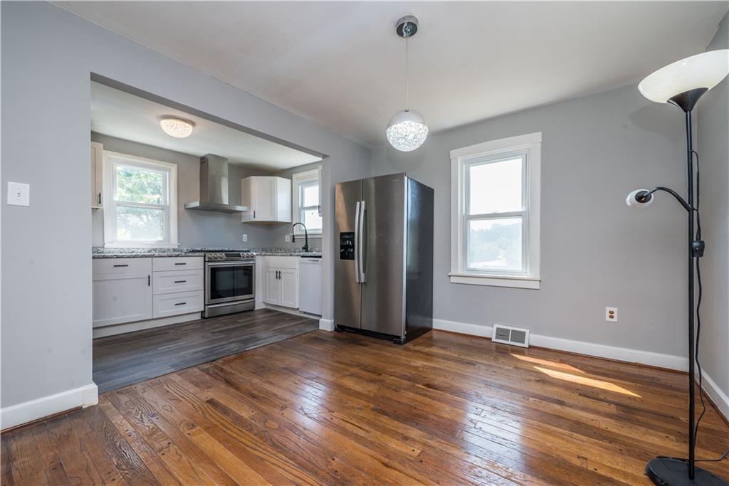 10780 Old Trail Road Irwin, PA 15642 - Photo 11 of 45 a kitchen with granite countertop a refrigerator and a stove