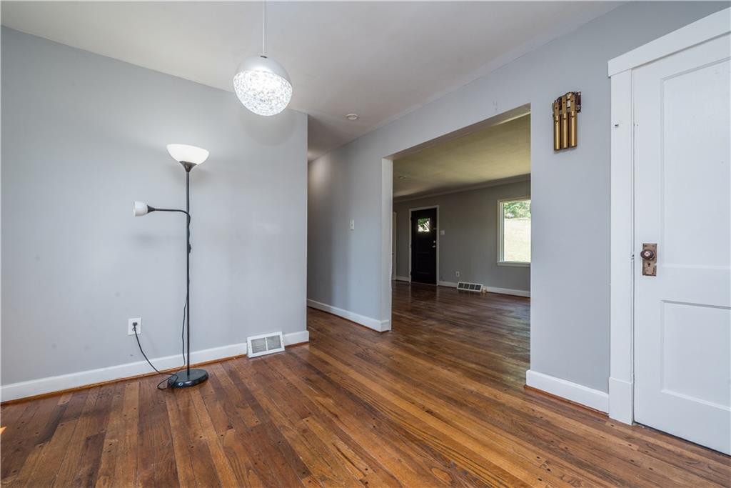 10780 Old Trail Road Irwin, PA 15642 - Photo 14 of 45 a view of an empty room with wooden floor and a window