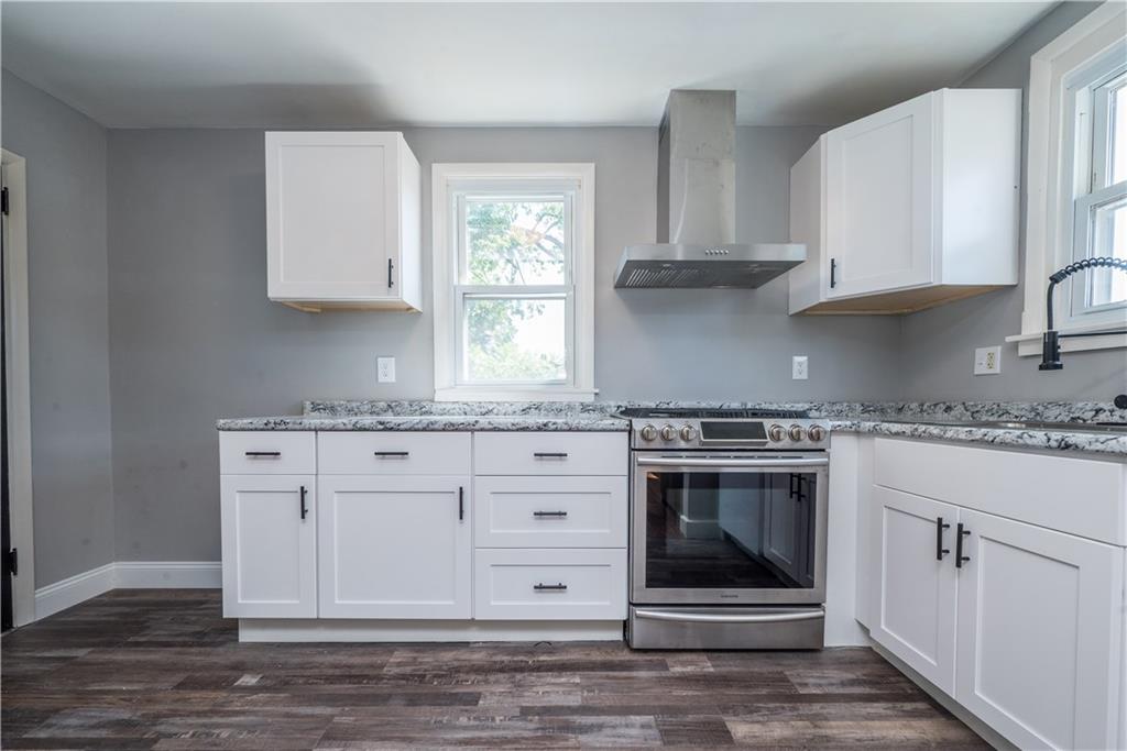 10780 Old Trail Road Irwin, PA 15642 - Photo 15 of 45 a kitchen with granite countertop white cabinets stainless steel appliances and sink