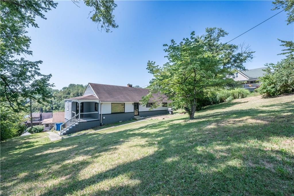 10780 Old Trail Road Irwin, PA 15642 - Photo 2 of 45 a view of a house with a yard