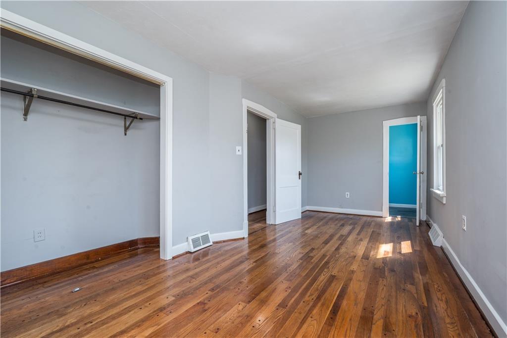 10780 Old Trail Road Irwin, PA 15642 - Photo 29 of 45 a view of an empty room with wooden floor and a window