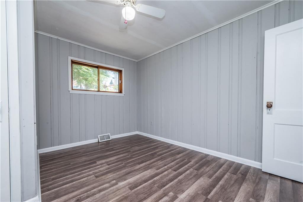 10780 Old Trail Road Irwin, PA 15642 - Photo 31 of 45 a view of empty room with wooden floor and fan