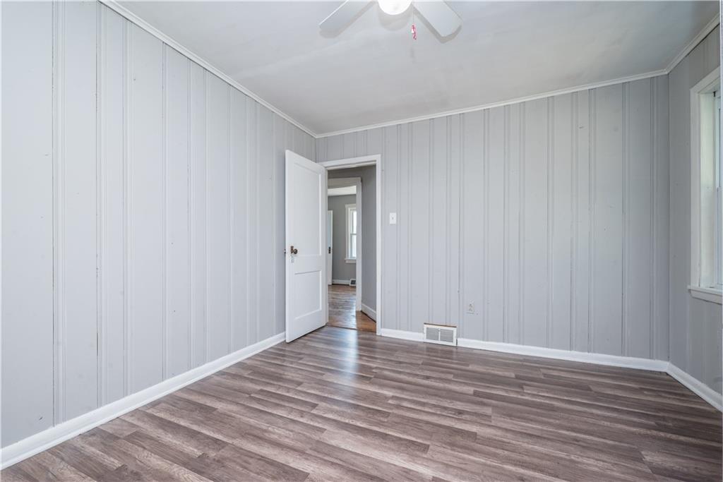 10780 Old Trail Road Irwin, PA 15642 - Photo 33 of 45 a view of an empty room with wooden floor