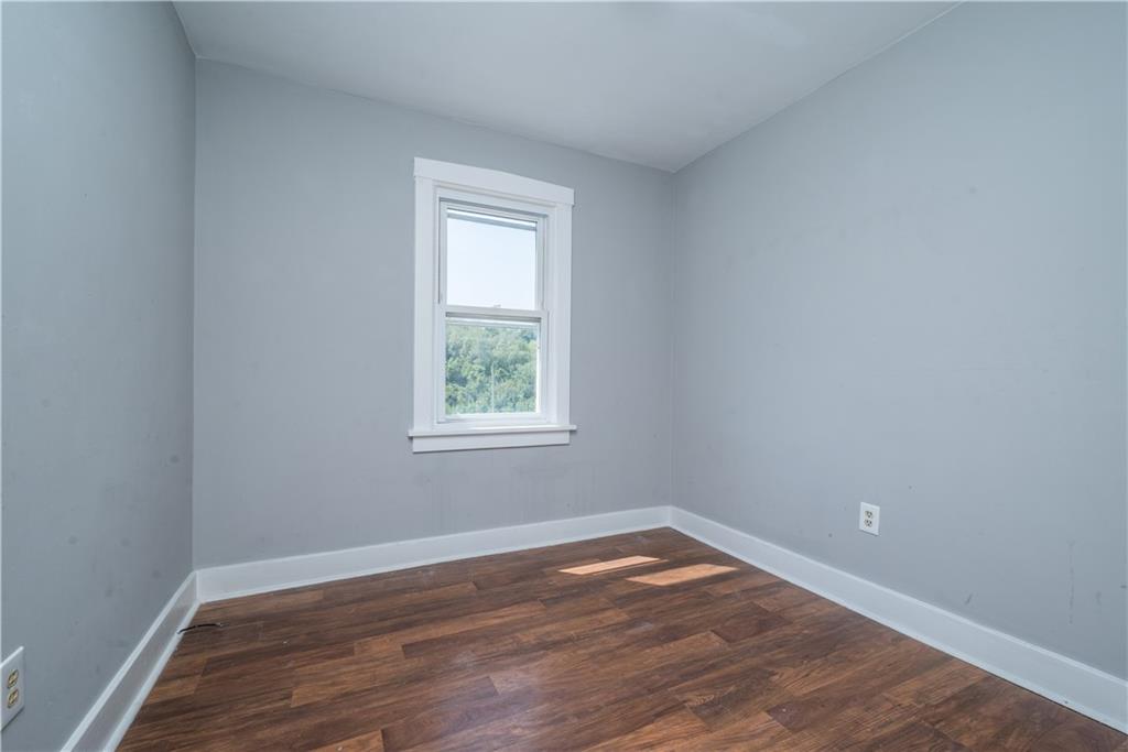 10780 Old Trail Road Irwin, PA 15642 - Photo 35 of 45 an empty room with wooden floor and window