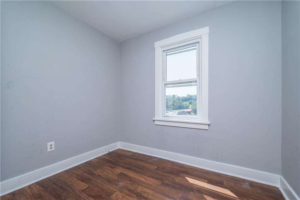 10780 Old Trail Road Irwin, PA 15642 - Photo 36 of 45 an empty room with wooden floor and a window